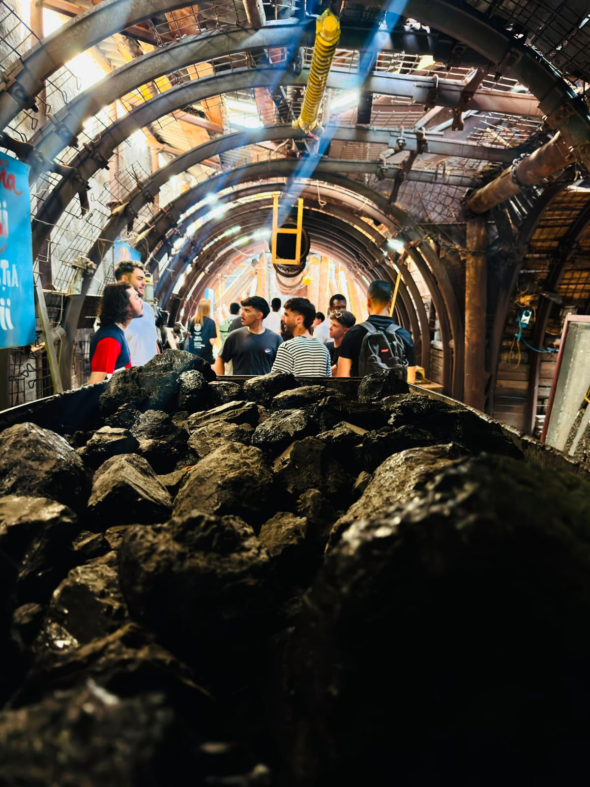 Visitors viewing coal wagons inside the mine tunnel